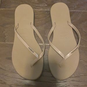 Khaki tan colored flip flops